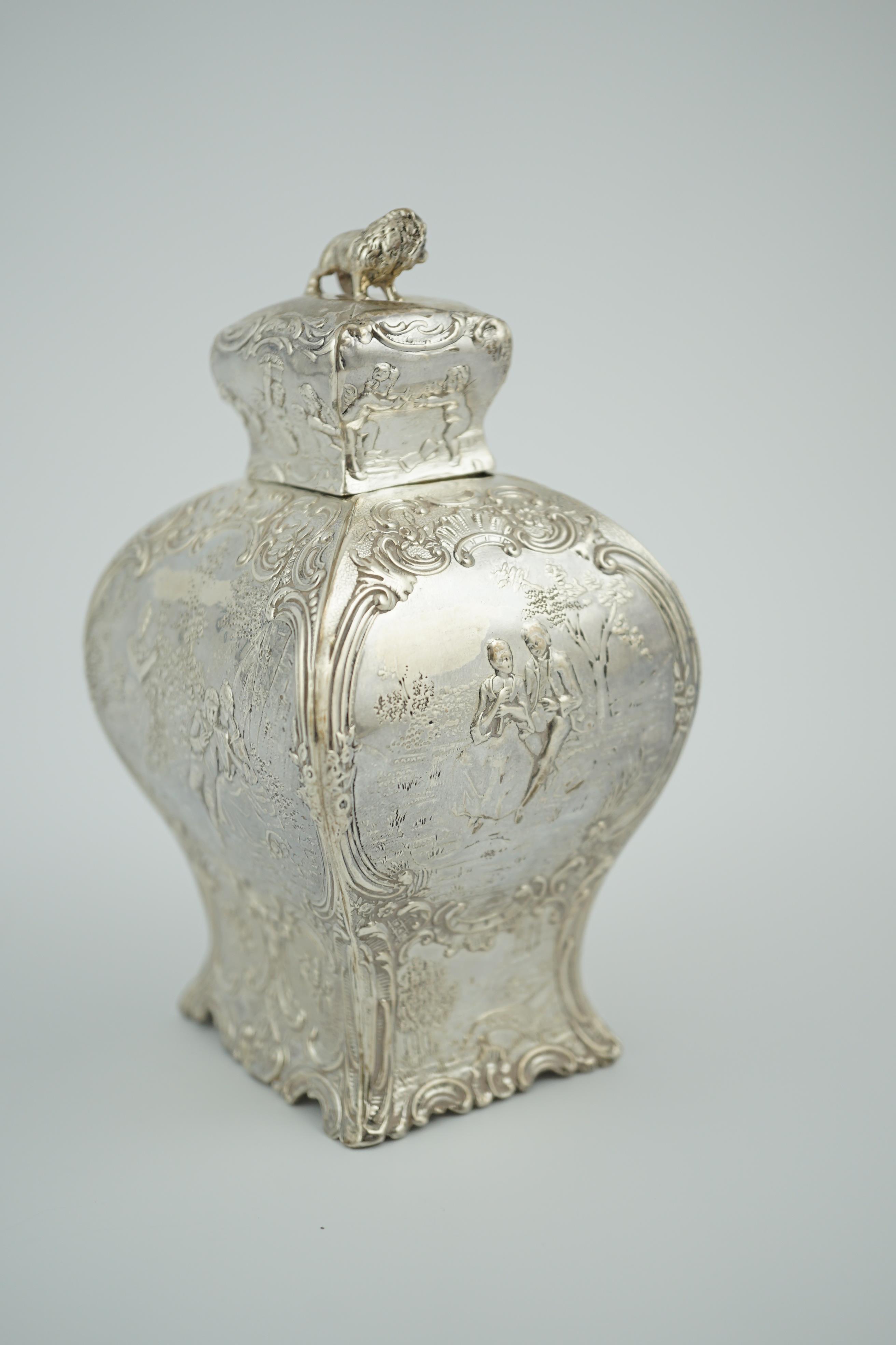 A late 19th century Hanau embossed silver bombé shaped tea caddy and cover